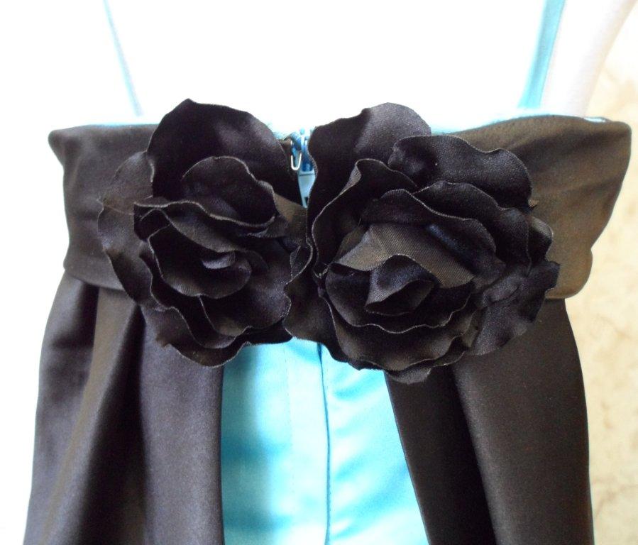 black flowers on back of sash