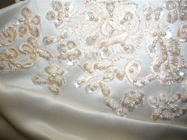 detailed applique and beading on champagne dress