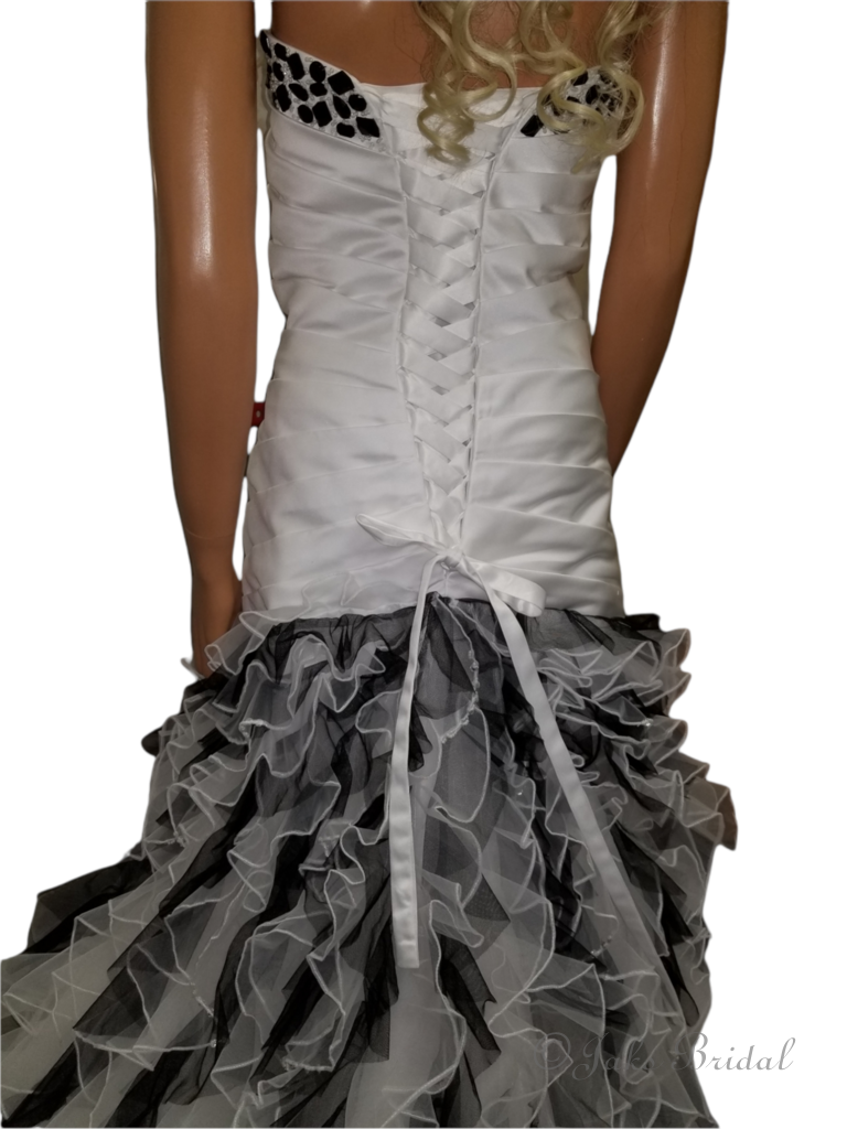ivory wedding dress with black beading and ruffles