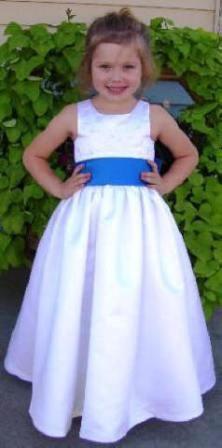 white flower girl dress with blue sash