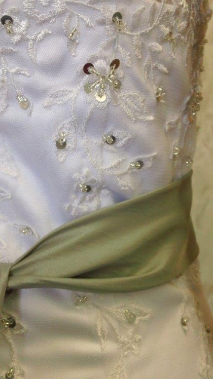 white wedding gown with gray sash