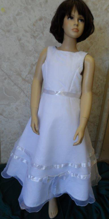 sleeveless white dress with rows of ribbon & bow