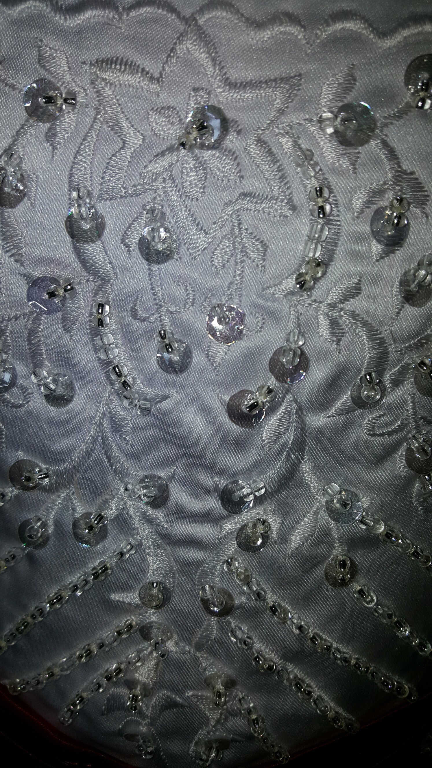 white embroidery with silver and clear beading