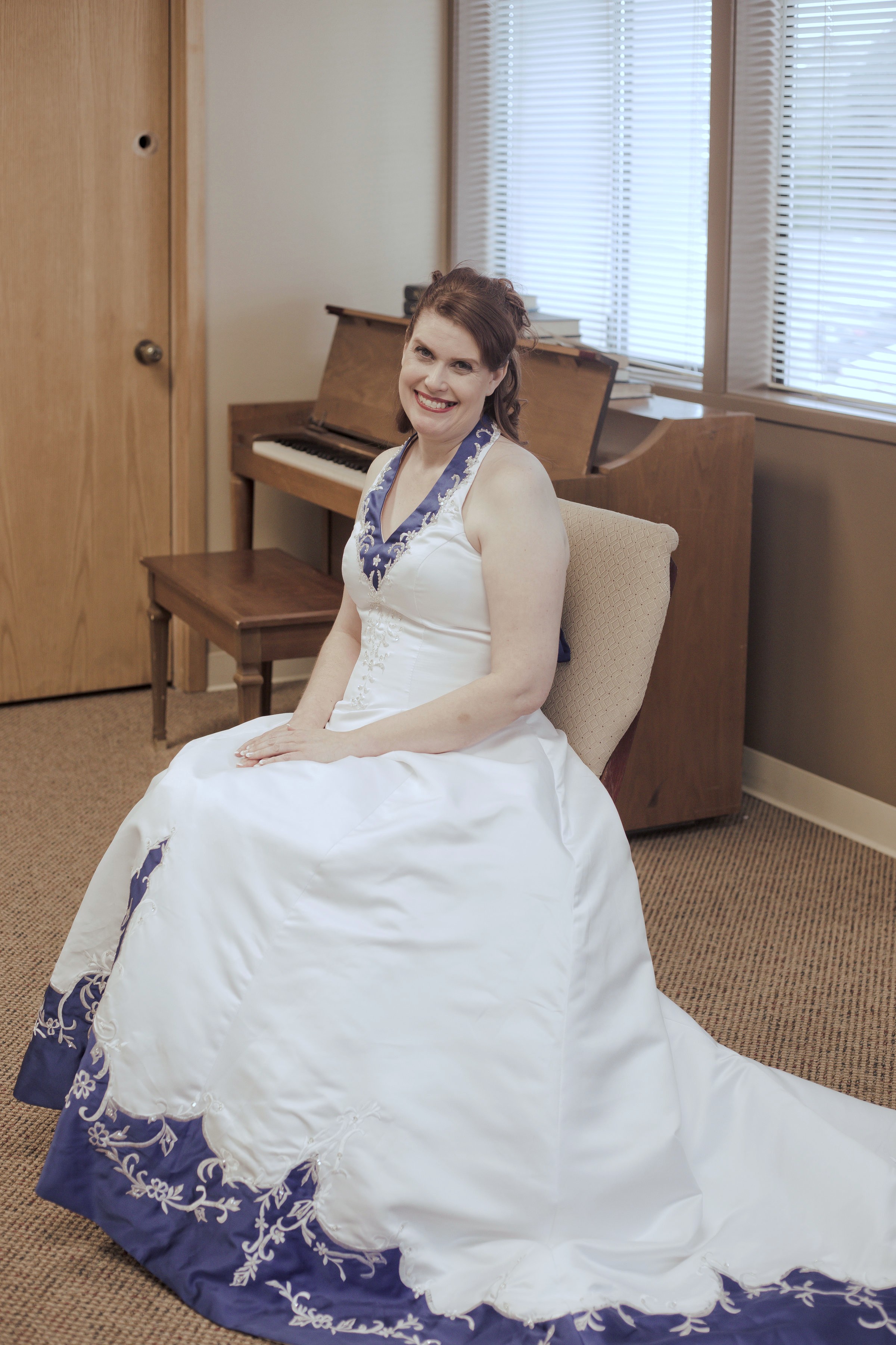 bride is wearing royal blue and white