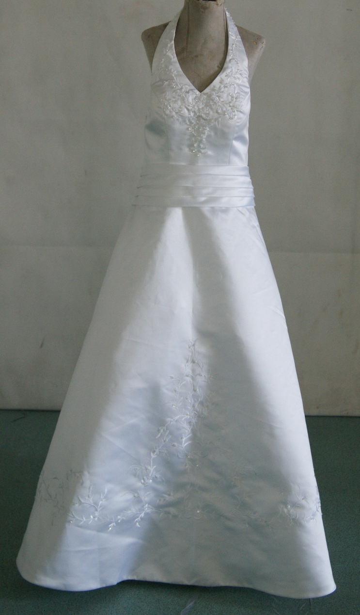 Halter flower girl dress made in white with white beading and sash
