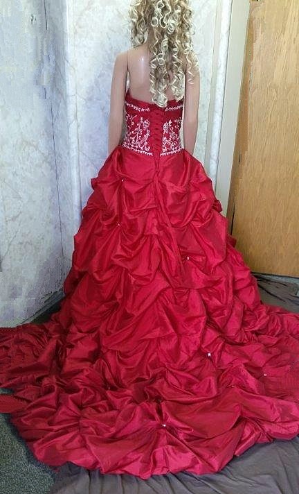 red wedding gown with pick up train