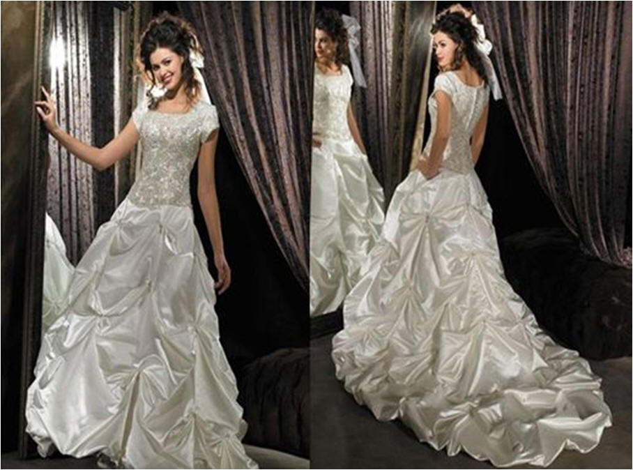 One piece satin short sleeve wedding gown Bodice is covered with Bead Pearl
