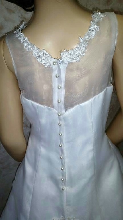 white flower girl dress with added beaded applique