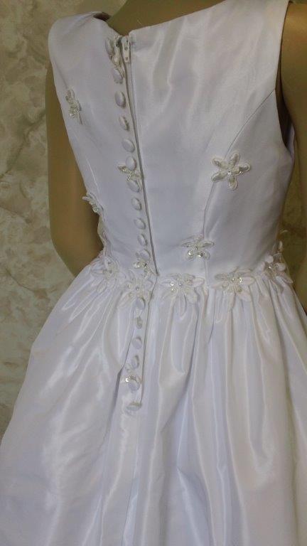 white dress with flower trim