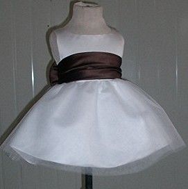 White infant dress with chocolate sash
