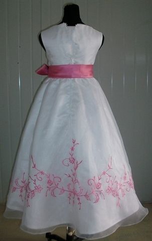 White girls dress with bubble gum pink trim and sash