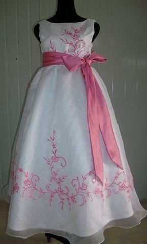 White custom dress with bubble gum pink trim and sash