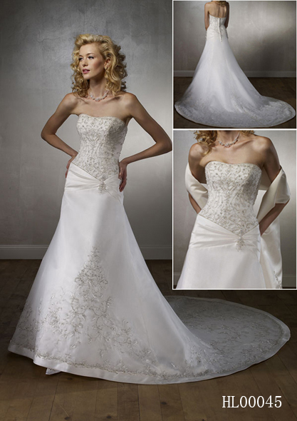 Embroidered net overlays the strapless bodice