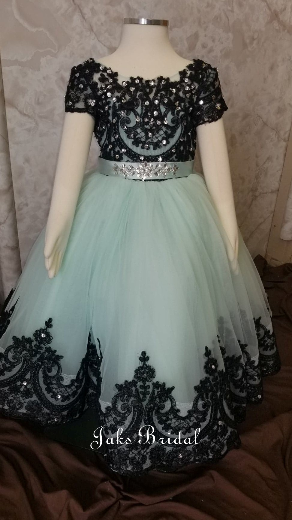 mint green and black ball gown
