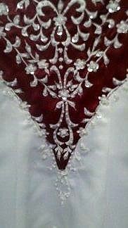white embroidery on red