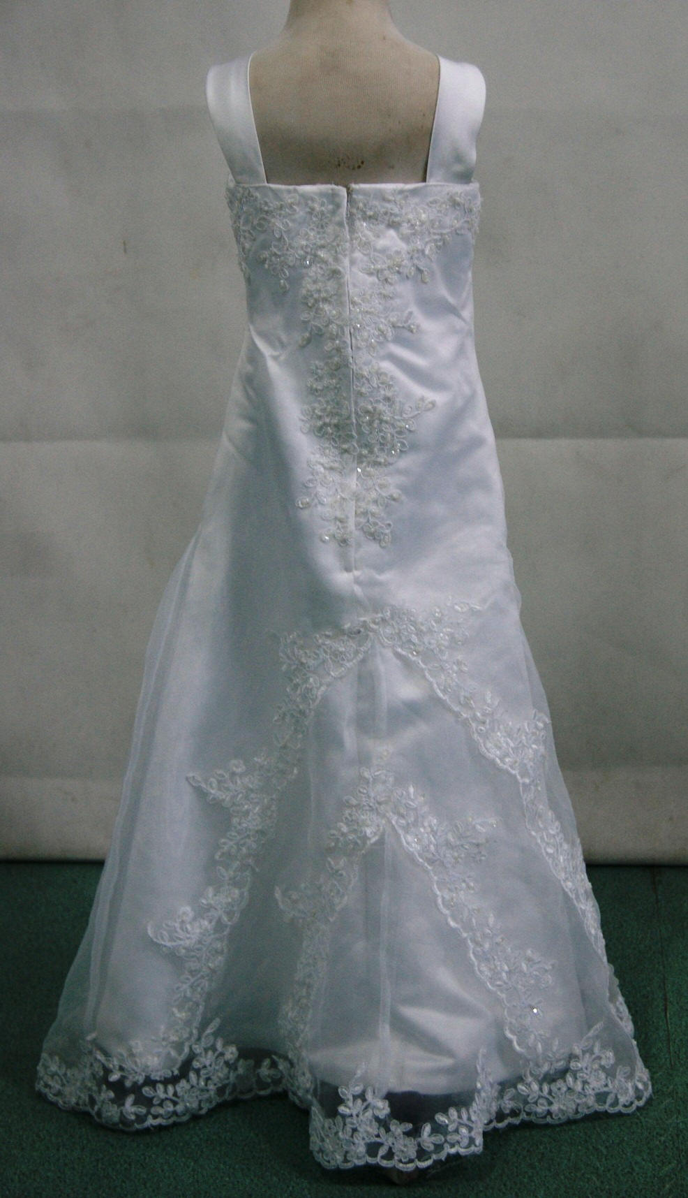 Miniature bridal gown with lace appliques.
