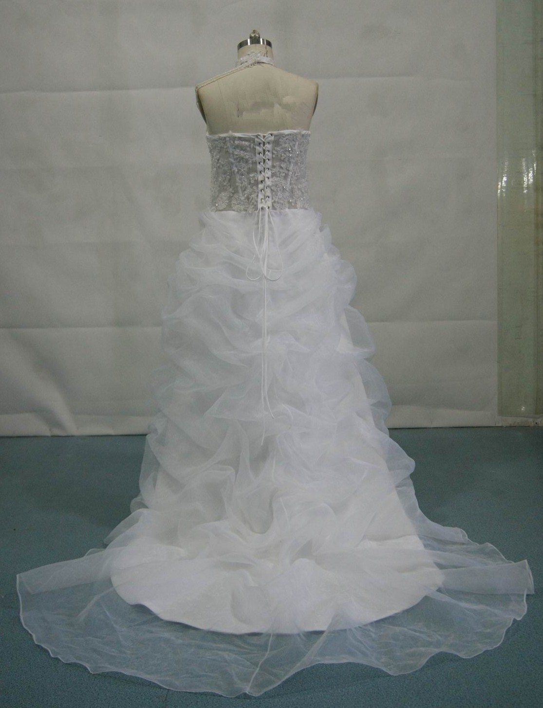 corseted-back gown is pictured in white with a see-through bodice