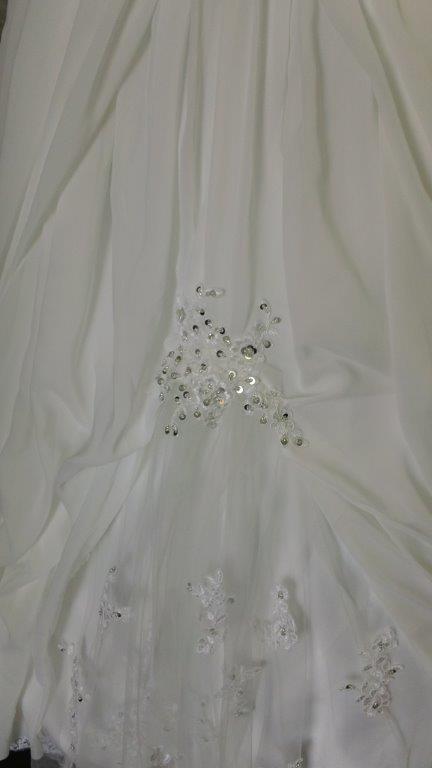 tulle inset with hand placed lace appliques