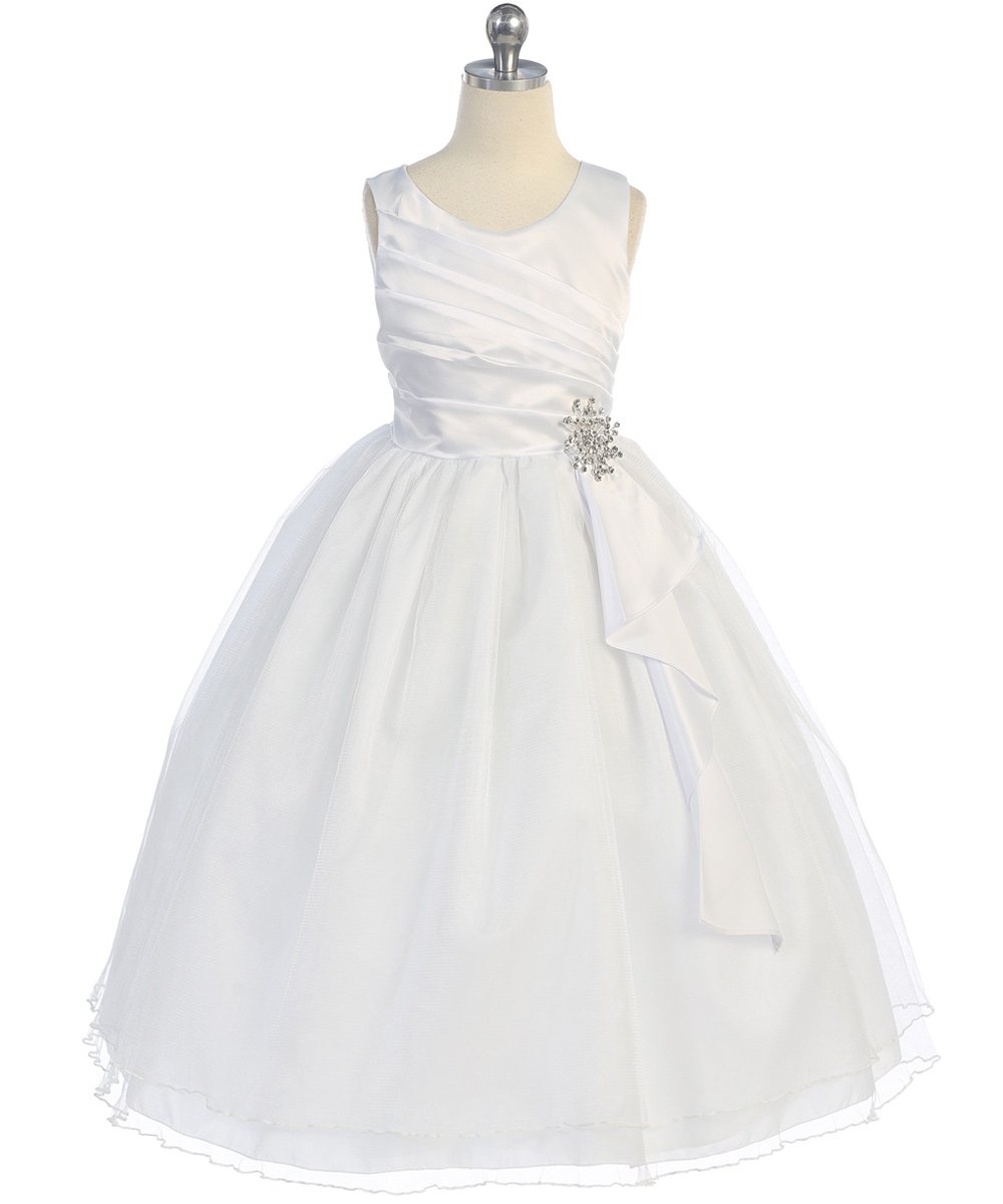 White dress with brooch on sash
