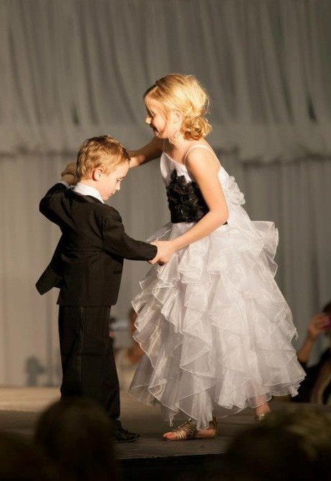 Flower girl and ring bearer cutting loose