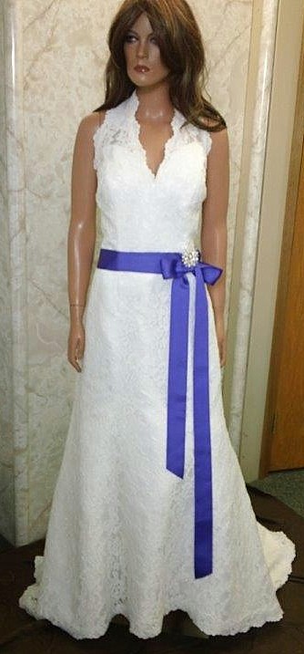 ivory wedding dress with purple sash