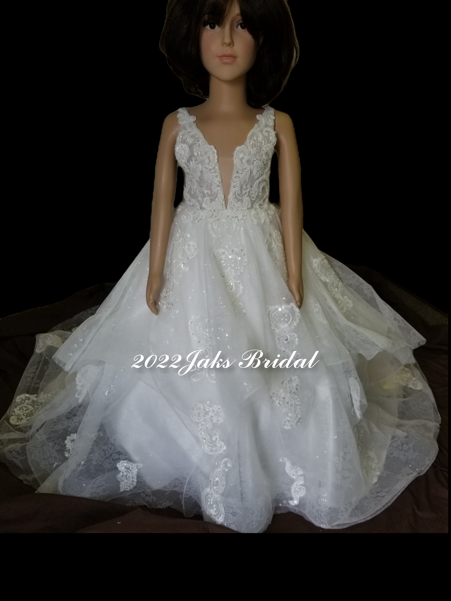 Little girls wedding dress with hand beaded crystals and pearls adds elegant sparkle to the bold ball gown of this designer flower girl dress. 