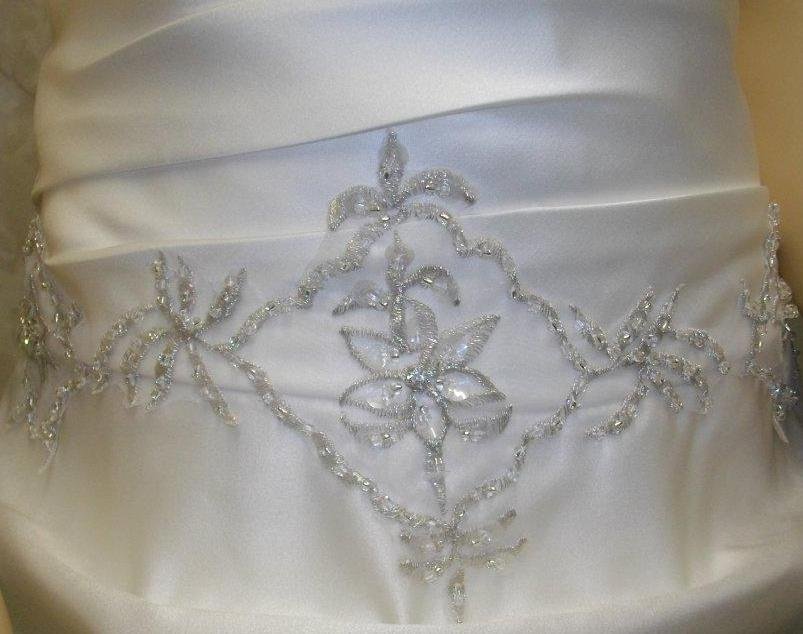 detailed embroidery on little girl wedding dress