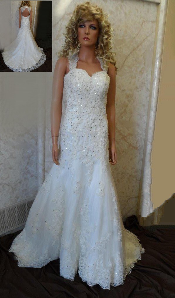 Lace wedding dress with open back and beaded wedding sash