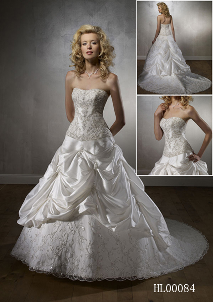 Strapless bridal ball gown, crystal beaded embroidery, strapless fitted bodice, dropped waistline, and chapel train.