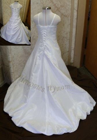 Baby daughters wedding dress, train says "Here comes my Mom".