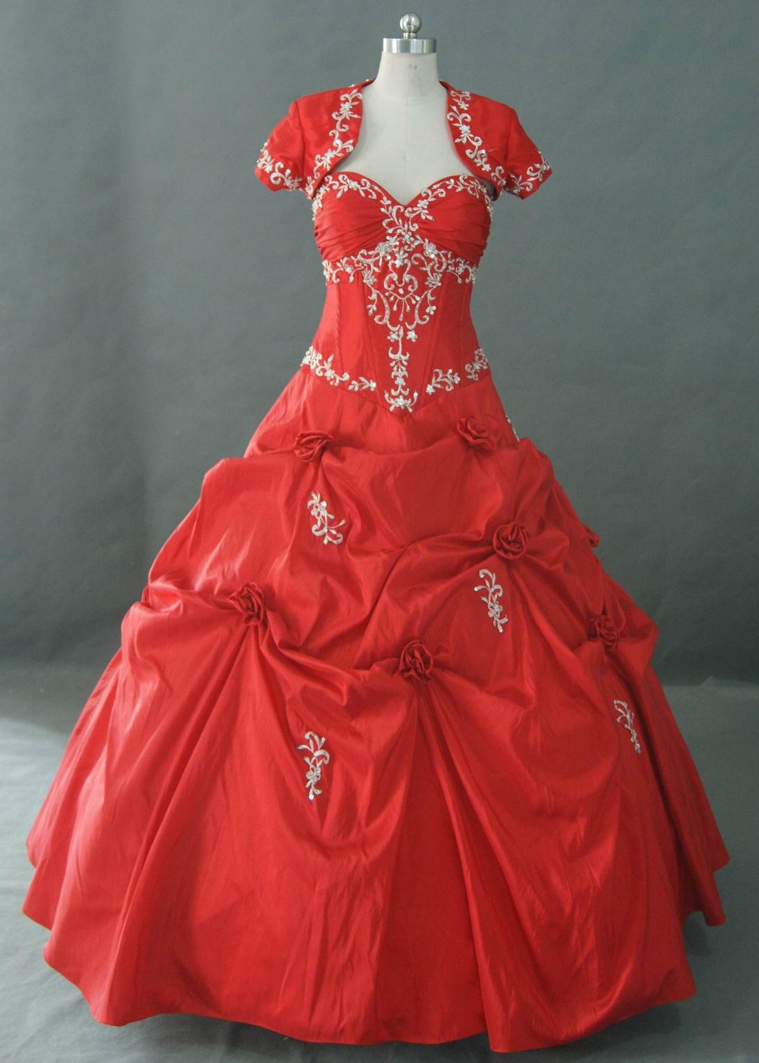 Red drop waist prom dress with flower detail.