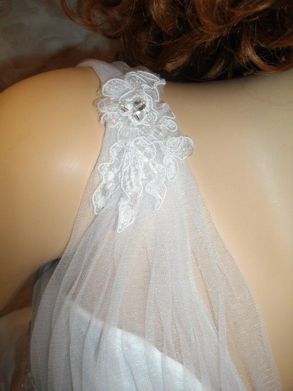 Sheer shoulder strap wedding gown.
